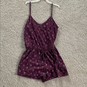 A size medium purple designed romper.